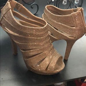 Gold sparkle heels shows size 6 but runs large